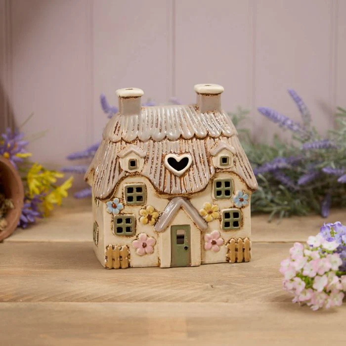RL STONEWARE LARGE THATCHED COTTAGE WITH EMBOSSED FLOWERS AND GREEN DOOR TEA LIGHT HOLDER